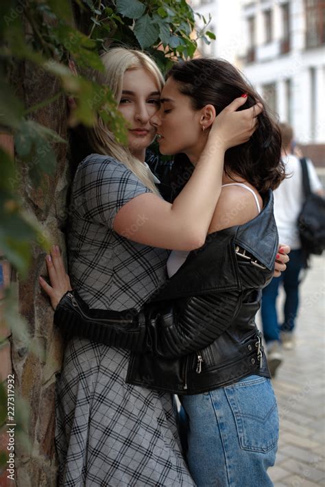 women kissing each other|Authentic LGBT female lesbian couple kissing each other in slow。